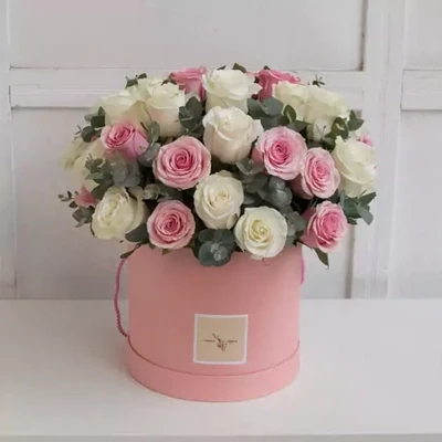Pink and white roses in a pink box