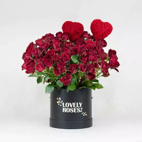 The arrangement is made with 25 red spray roses and red decorative hearts.
