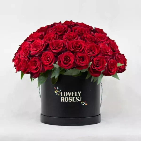 The arrangement in a round box with 50 red roses.