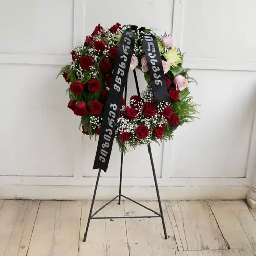 Funeral wreath with roses and gypsophilas