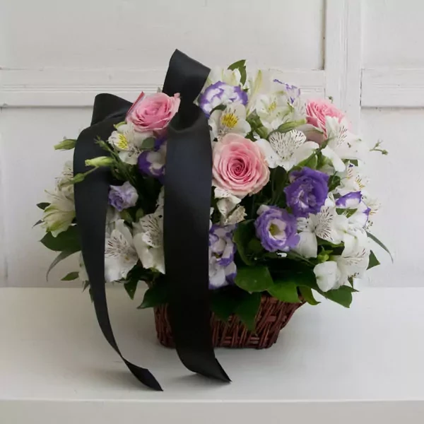 Funeral basket with pink roses