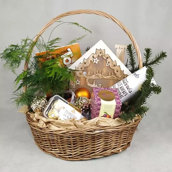 Basket with asparagus and sweets
