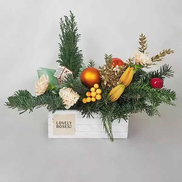 Christmas arrangement with a house toy