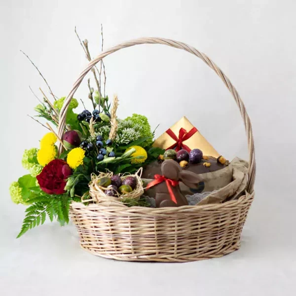 Easter basket with cake and chocolates