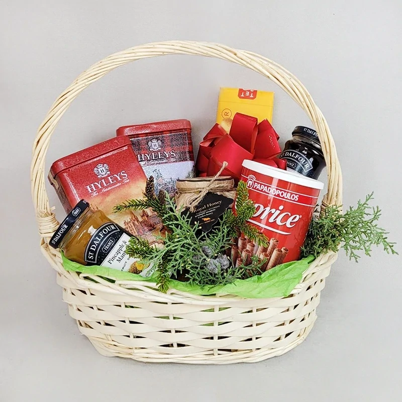 Basket with asparagus and sweets