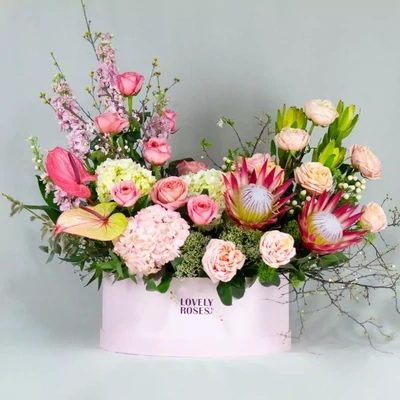 Arrangement with hortensias and proteas (
