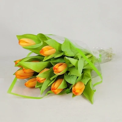 The bouquet is made of orange tulips.

