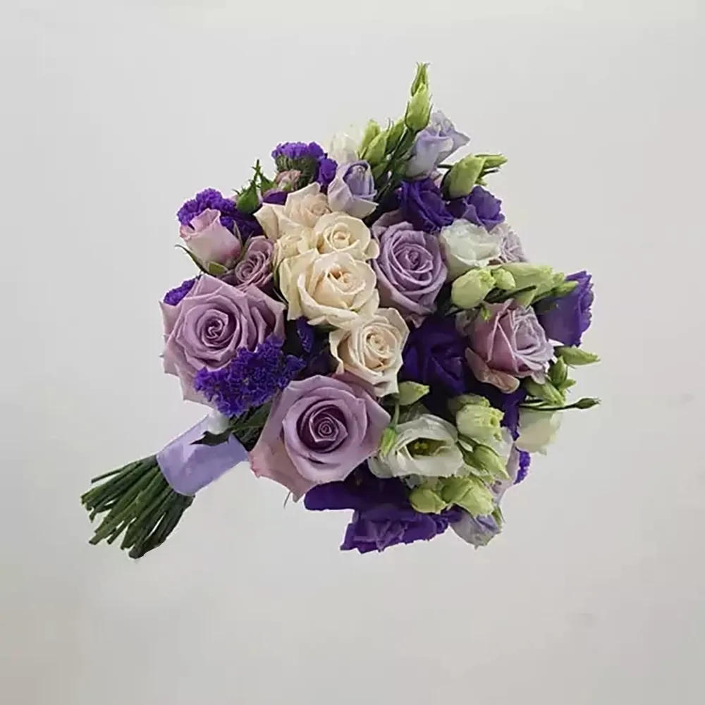 Wedding bouquet in purple colors, using roses, eustoma and other auxiliary flowers