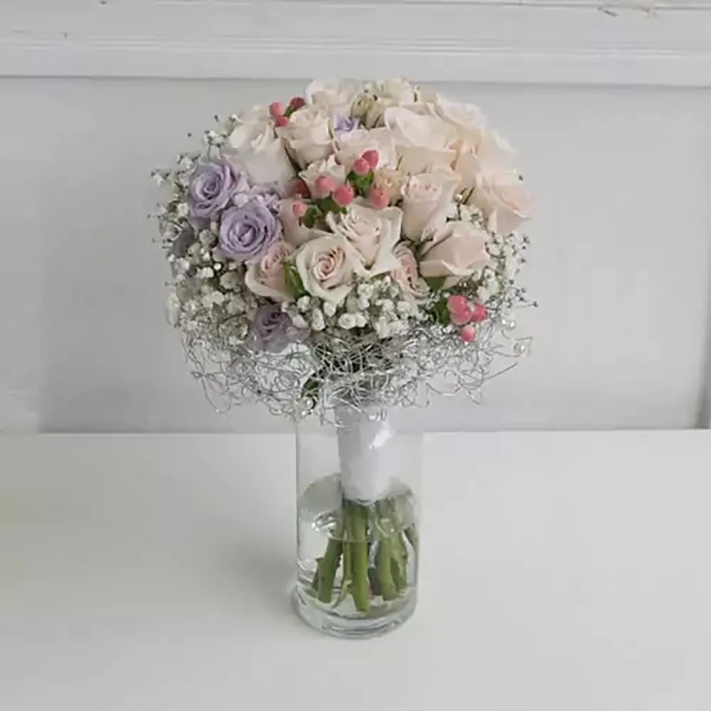 Wedding bouquet with roses and gypsophila