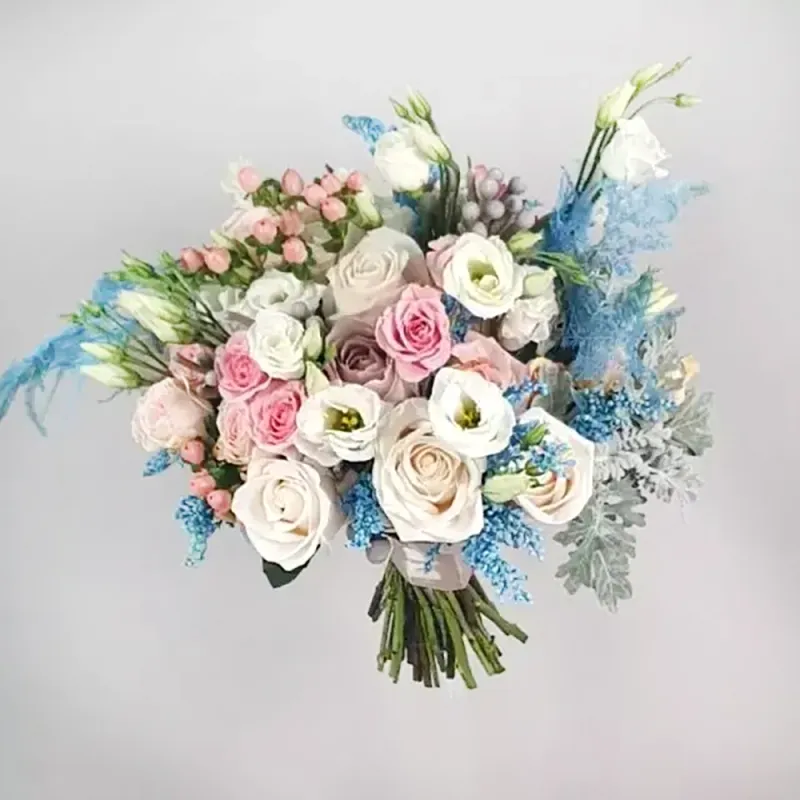 Wedding bouquet with pink, white and blue flowers