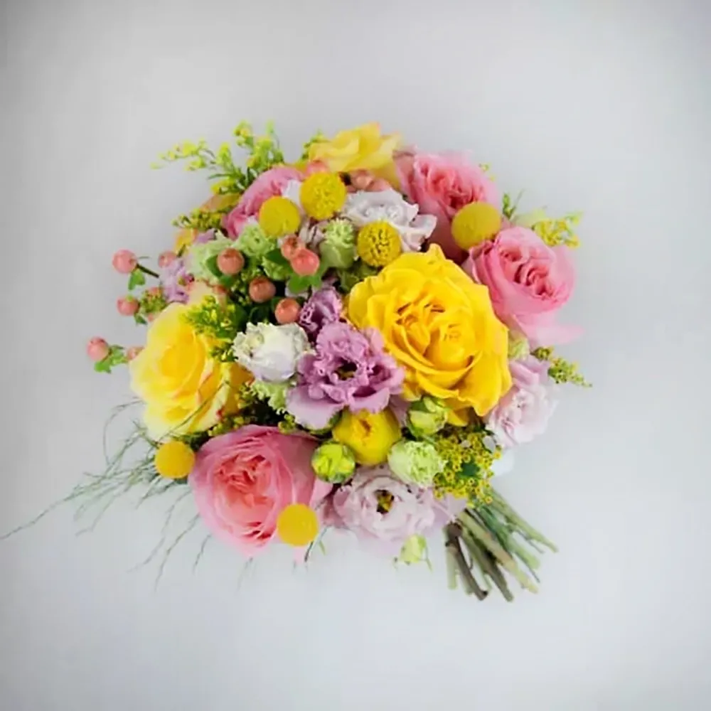 Colorful wedding bouquet with yellow and pink flowers