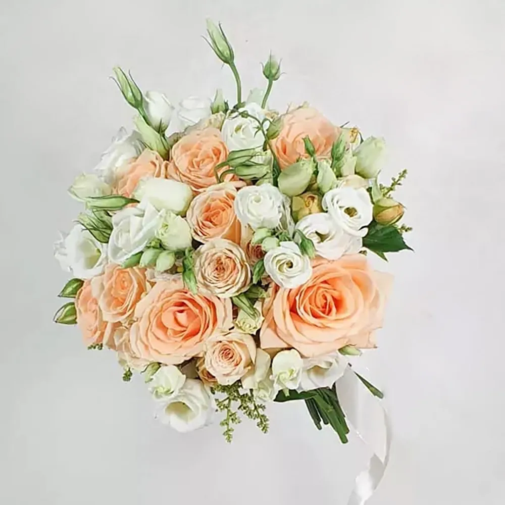 Wedding bouquet in beige and white colors