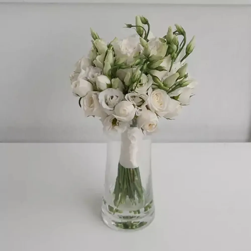 Gentle wedding bouquet in white colors