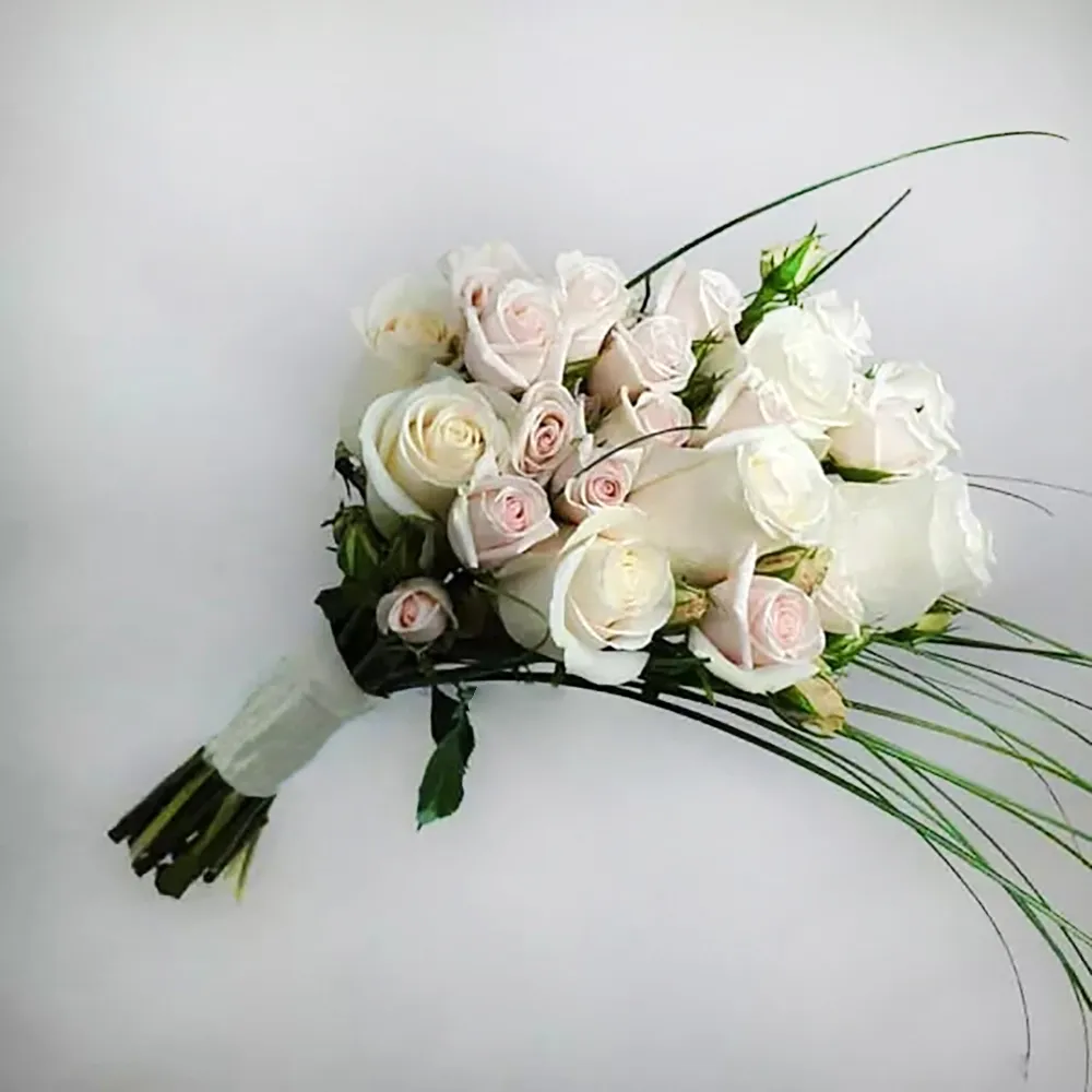 Wedding bouquet with white and cream roses and berggrass