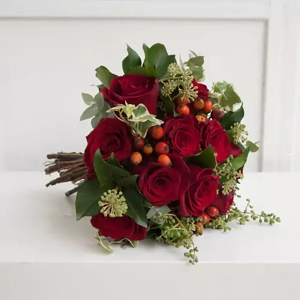 Red Wedding Bouquet This wedding bouquet features red roses and hypericum.
