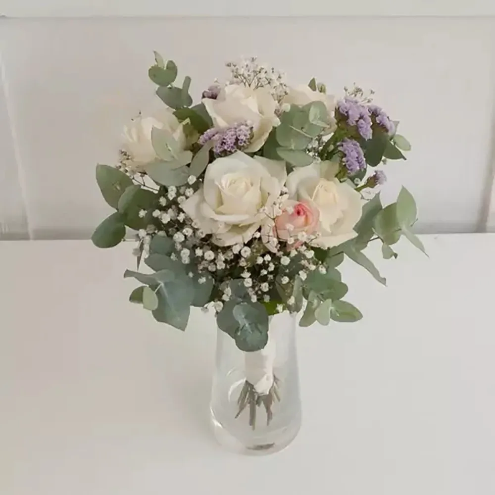 The wedding bouquet is made of eucalyptus, gypsophila and other flowers
