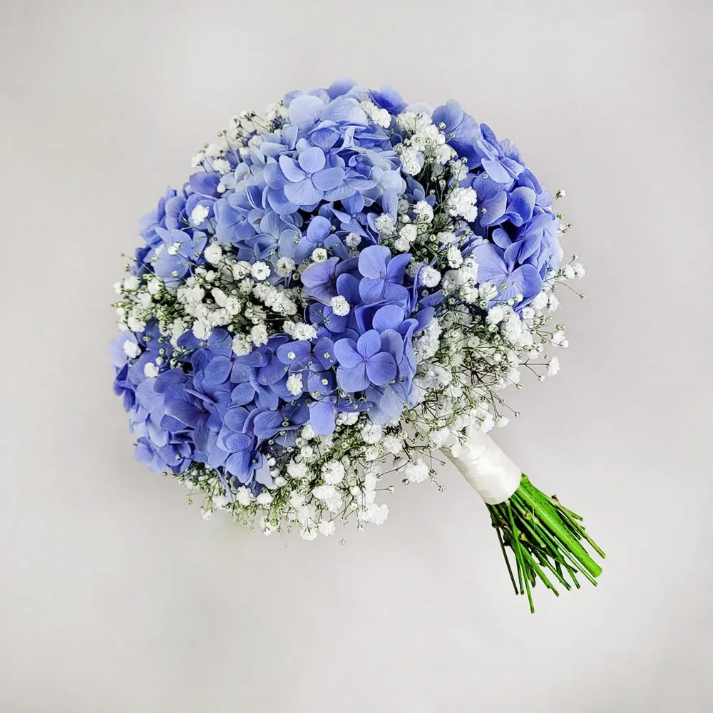 Wedding bouquet with blue hydrangea and white gypsophila