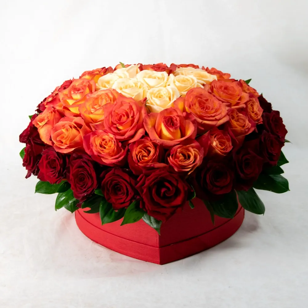 Different roses in a heart-shaped box