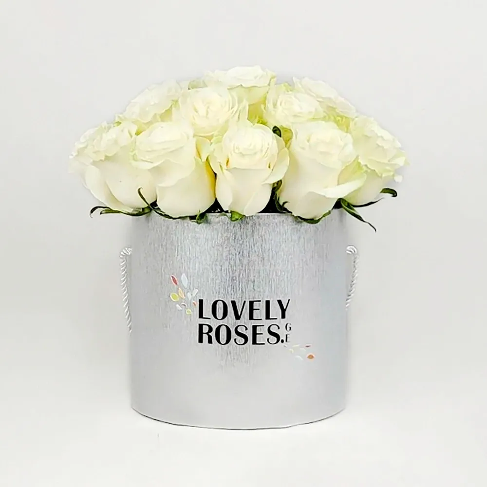 White roses in a silver box