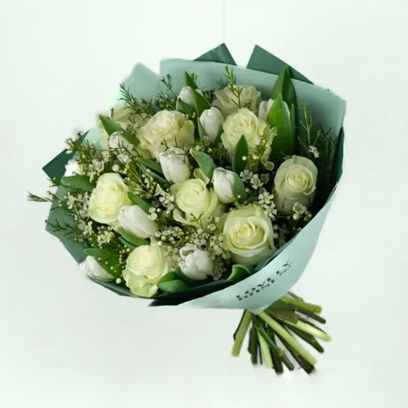 Delicate bouquet with roses and tulips