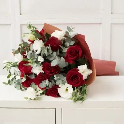 Bouquet of red roses with white eustoma