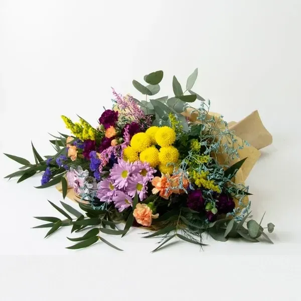The bouquet is made with seasonal flowers in the style of wildflowers.