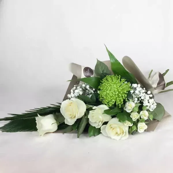 The bouquet uses cycad, rose, spray rose, gypsophila, and chrysanthemum.