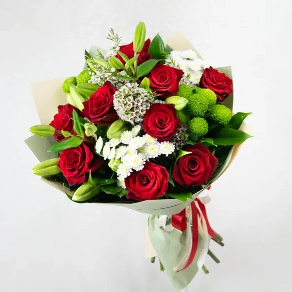 he bouquet is made of roses in red, white and green tones.