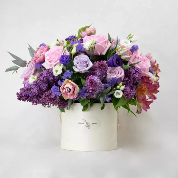 Lilacs and roses are used in the composition. The approximate size of the composition is 40x32 cm.

