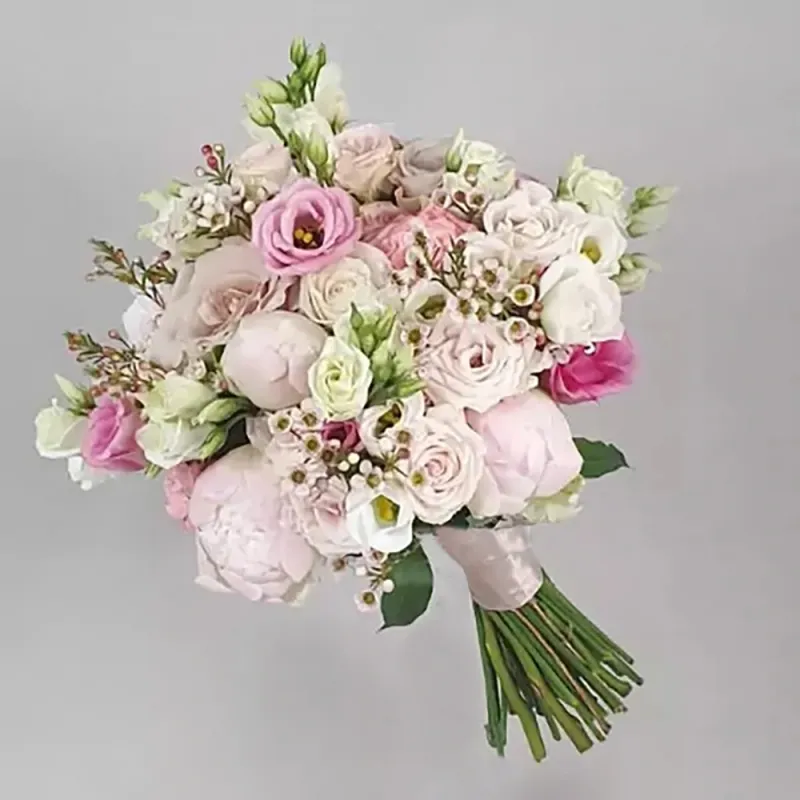 The wedding bouquet consists of pink and white flowers
