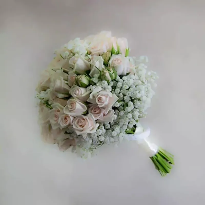 Wedding bouquet with cream spray roses and white gypsophila