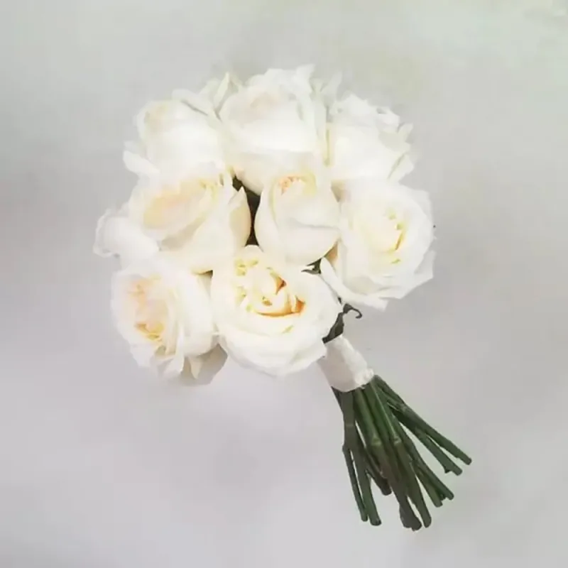 Wedding bouquet of white peonies with s-like roses, white ocher