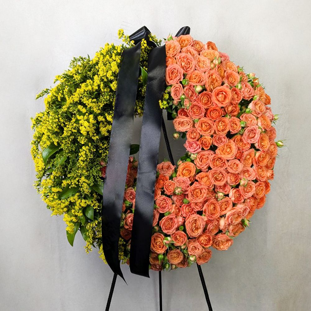 Funeral wreath with orange roses