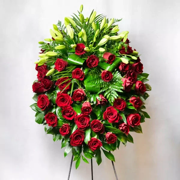 Funeral crown consists of red roses and lillies