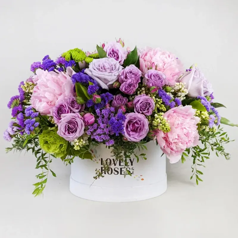 Arrangement in purple with peonies
