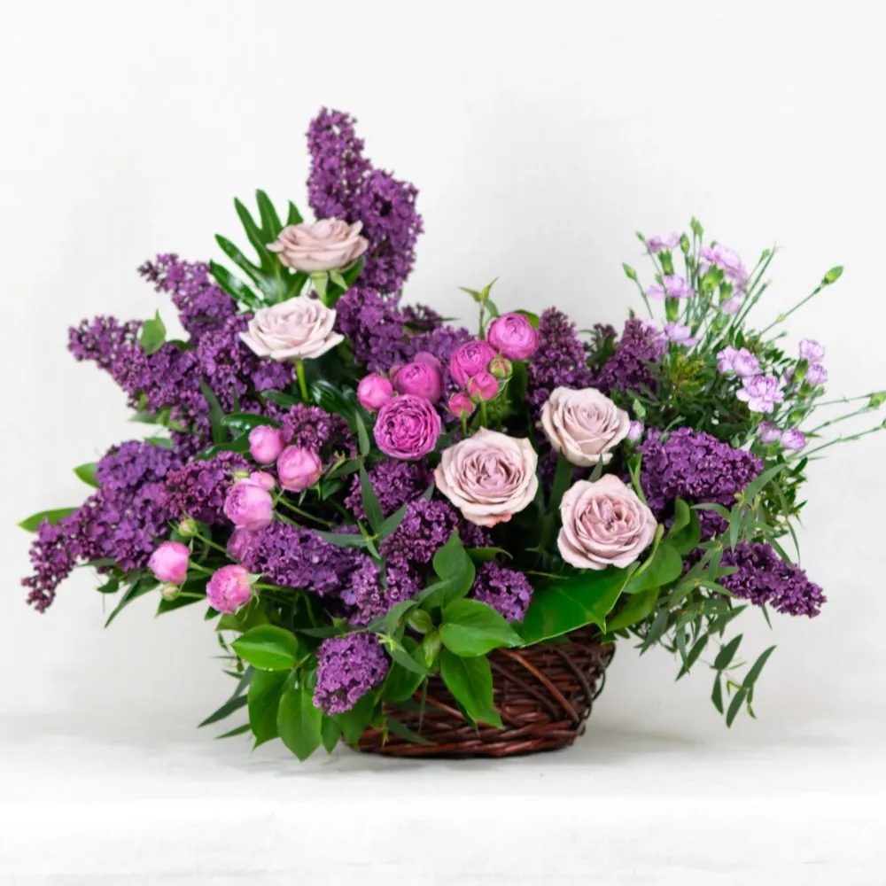 Basket with lilac and roses
