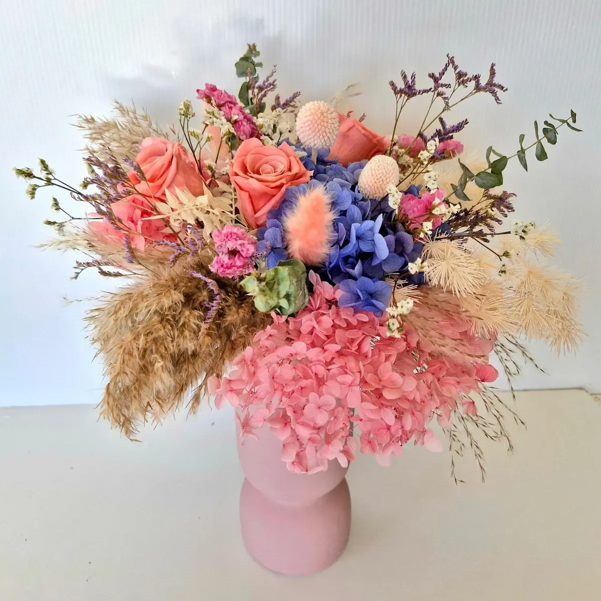 Vibrant Havana dried flower arrangement in a stylish ceramic vase, perfect for adding bold colour to your home.