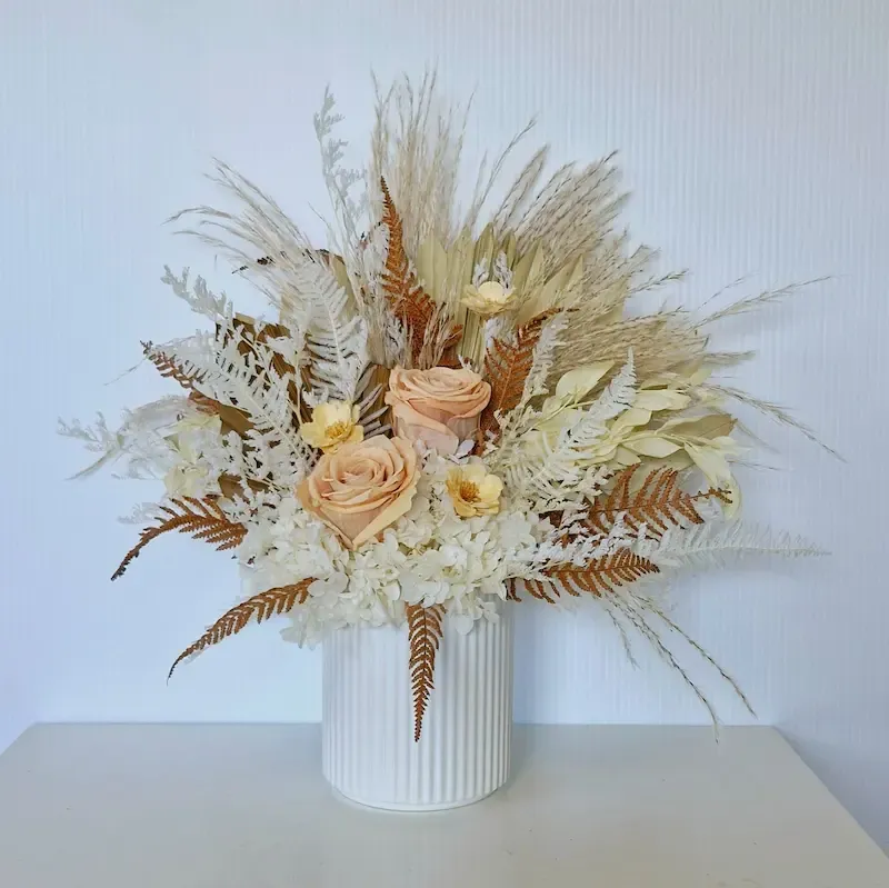 Haven dried floral arrangement in a textured white ceramic pot, perfect for adding natural elegance to any home.