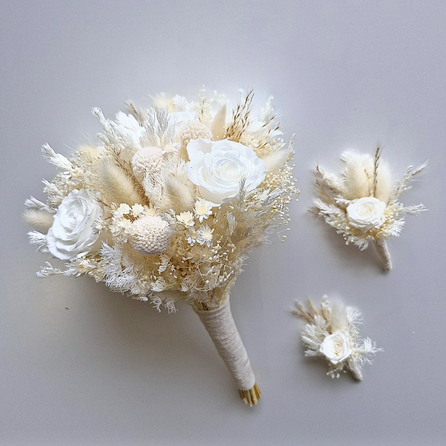 Medium Bridal Bouquet with preserved roses, plus 1 adult and 1 child buttohole in whites and creams