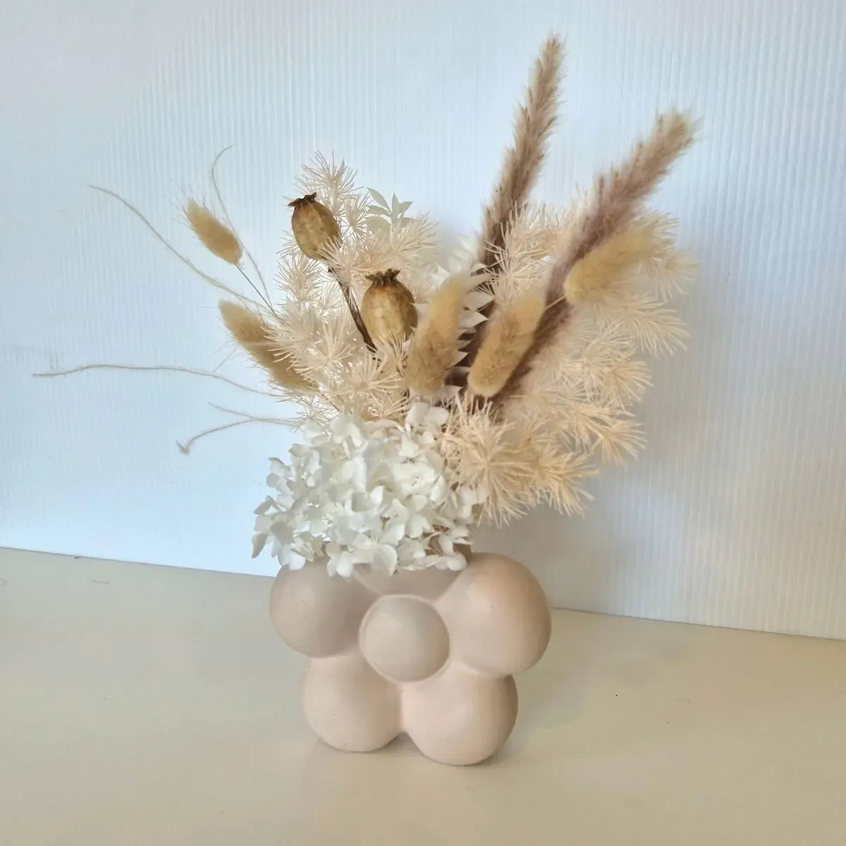 Side view of the Bloom bud vase in White &amp; Nude showing soft preserved florals and gentle textures.