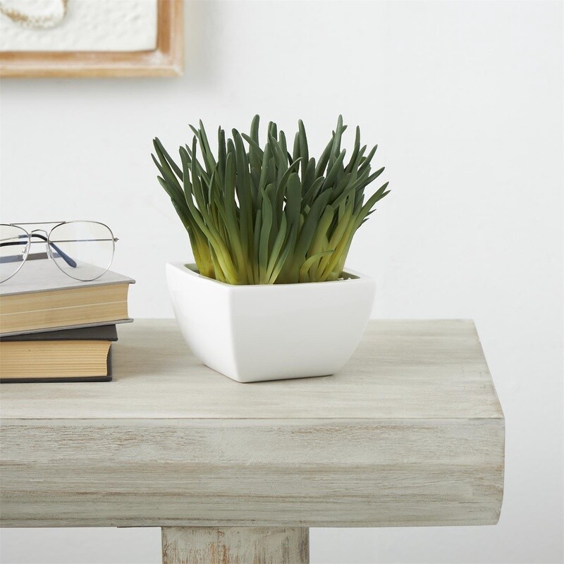 GREEN FAUX FOLIAGE IN WHITE CERAMIC POT