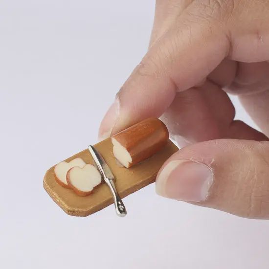 Miniature Bread On Wood Cutting Board