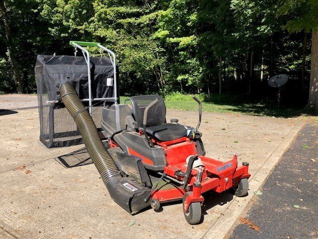 Universal outlet mower bagger
