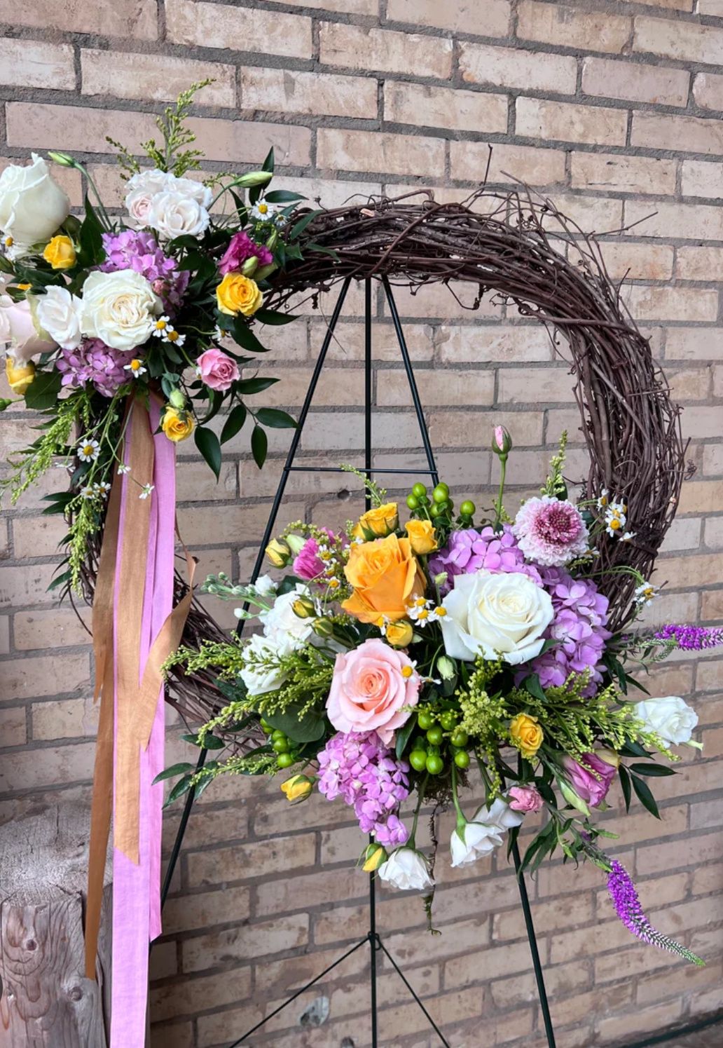 Colorful grapevine wreath standing spray