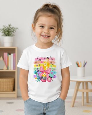 Girl wearing a white kids size 3-4 back-to-school T-shirt with colorful pencil, crayons, pink bow, and rainbow design.