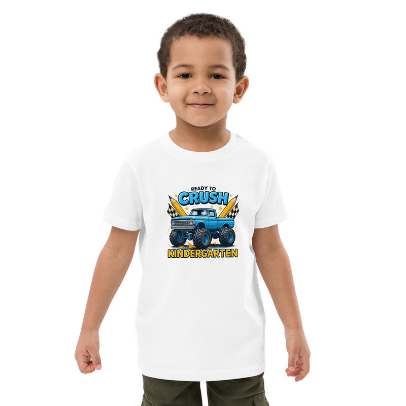 Young boy wearing a white “Ready to Crush Kindergarten” monster truck T-shirt for back-to-school.