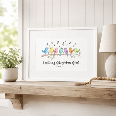 White framed Psalm 89:1 singing birds print styled on a bright farmhouse shelf with neutral decor.