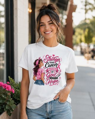 Smiling brunette wearing a white breast cancer awareness T-shirt with “Stronger Than Cancer, Blessed by God” design.