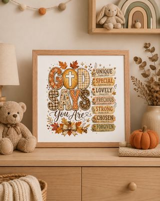 Red oak framed “God Says You Are” Christian fall print displayed on a cozy nursery dresser.