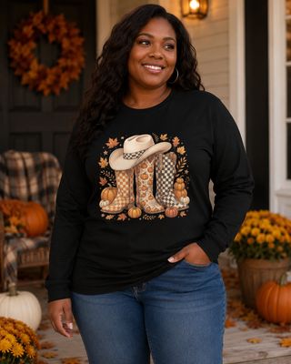 Plus-size Black woman wearing a black fall cowboy boots long sleeve shirt on an autumn porch.